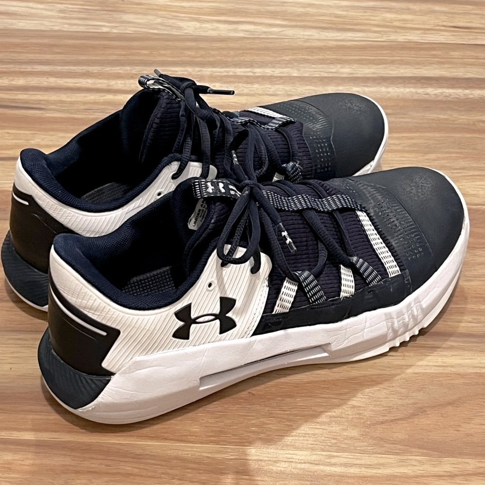 Dark Blue and White Size 12 Men’s Under Armour Indoor Volleyball Shoes.